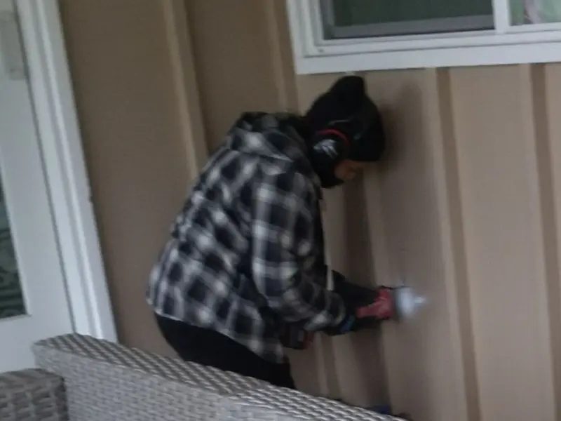 Professional electrician installing an exterior outlet in Midlothian