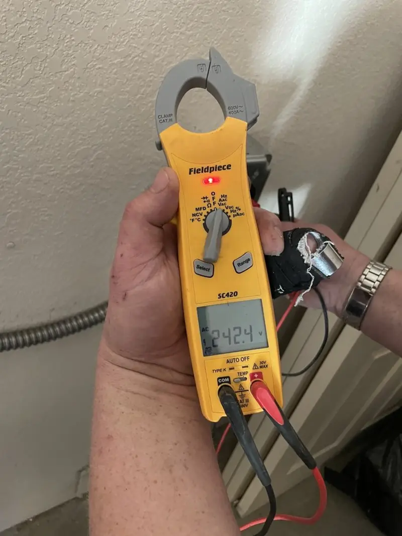 Voltage testing with clamp meter during Outlet Installation in Midlothian